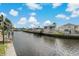 Calm canal view with multiple houses and boats at 9 Grace St, Crystal Beach, FL 34681