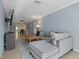 Open concept living room with sectional sofa and view to dining area at 9 Grace St, Crystal Beach, FL 34681