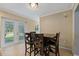Dining area with table and four chairs, near kitchen at 9 Grace St, Crystal Beach, FL 34681
