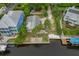 Aerial view showing a home's location on a canal at 9 Grace St, Crystal Beach, FL 34681