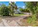 Landscaped backyard with brick pavers and shed at 9 Grace St, Crystal Beach, FL 34681