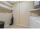 Laundry room with shelving, vacuum, and washer/dryer hookups at 9 Grace St, Crystal Beach, FL 34681