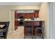 Kitchen with granite countertops and dark wood cabinets at 9 Grace St, Crystal Beach, FL 34681