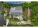 Aerial view of a waterfront property with a home and patio at 9 Grace St, Crystal Beach, FL 34681