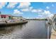 Residential canal view showing houses and boats at 9 Grace St, Crystal Beach, FL 34681