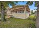 Quaint house exterior with a covered porch and manicured lawn at 1501 28Th N Ave, St Petersburg, FL 33704