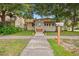 Front view of the house with a landscaped yard and walkway at 1501 28Th N Ave, St Petersburg, FL 33704