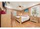 Main bedroom with large bed, ample closet space, and hardwood floors at 1501 28Th N Ave, St Petersburg, FL 33704