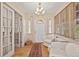Bright and airy entryway with hardwood floors and comfortable seating at 1501 28Th N Ave, St Petersburg, FL 33704