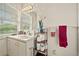 Bright bathroom with single sink vanity and window at 1501 28Th N Ave, St Petersburg, FL 33704