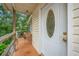 Front entrance with a charming glass door and small porch at 1501 28Th N Ave, St Petersburg, FL 33704