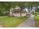 Charming bungalow with a front porch and manicured lawn at 1501 28Th N Ave, St Petersburg, FL 33704