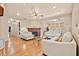 Spacious living room with hardwood floors, a fireplace, and ample natural light at 1501 28Th N Ave, St Petersburg, FL 33704