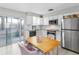 Modern kitchen with white cabinets and stainless steel appliances at 3124 Lecanto St, Holiday, FL 34691
