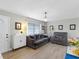 Bright living room with comfy sofas and stylish decor at 3124 Lecanto St, Holiday, FL 34691