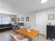 Charming dining area with a wooden table and pink chairs at 3124 Lecanto St, Holiday, FL 34691