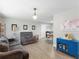 Open living room with gray sofas and blue cabinet at 3124 Lecanto St, Holiday, FL 34691