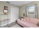 Home office featuring a pink sofa and a convenient workspace at 3124 Lecanto St, Holiday, FL 34691