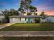 Charming single story house with teal door at 3124 Lecanto St, Holiday, FL 34691