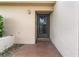 Front entry of townhouse with tiled patio at 3849 Staysail Ln, Holiday, FL 34691