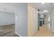 Hallway view of a home with light gray and yellow walls at 3849 Staysail Ln, Holiday, FL 34691
