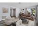 Bright living room featuring hardwood floors, neutral walls, and ample natural light at 3849 Staysail Ln, Holiday, FL 34691