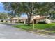 Exterior view of townhouses with landscaping at 3849 Staysail Ln, Holiday, FL 34691