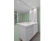 Modern bathroom with a floating vanity and a large mirror at 3849 Staysail Ln, Holiday, FL 34691