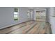 Bright dining room with hardwood floors and access to a private patio at 3849 Staysail Ln, Holiday, FL 34691