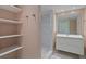 Updated bathroom with walk-in shower, built-in shelving, and modern vanity at 3849 Staysail Ln, Holiday, FL 34691