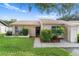 Front view of townhouse with landscaping at 3849 Staysail Ln, Holiday, FL 34691