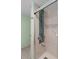 Bathroom with tiled shower and neutral color palette at 3849 Staysail Ln, Holiday, FL 34691