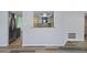 Kitchen view from living room, features teal cabinets and granite counters at 3849 Staysail Ln, Holiday, FL 34691