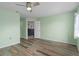 Bedroom with door to kitchen and light green walls at 3849 Staysail Ln, Holiday, FL 34691