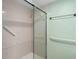 Walk-in shower with grab bars and tiled walls at 3849 Staysail Ln, Holiday, FL 34691