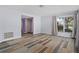 Spacious living area showcasing stylish hardwood flooring and large windows at 3849 Staysail Ln, Holiday, FL 34691