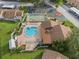 Community pool and shuffleboard from above at 3849 Staysail Ln, Holiday, FL 34691
