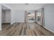 Living room with wood-look floors and access to an entryway at 3849 Staysail Ln, Holiday, FL 34691