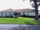 Single story home with a large green lawn at 8360 High Point Cir # 3, Port Richey, FL 34668