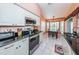 Well-equipped kitchen with stainless steel appliances and breakfast nook at 9727 Oakwood Hills Ct, New Port Richey, FL 34655
