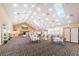 Large banquet hall with tables and chairs at 9727 Oakwood Hills Ct, New Port Richey, FL 34655