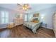 Main bedroom with wood flooring and lots of natural light at 9727 Oakwood Hills Ct, New Port Richey, FL 34655