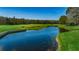 Golf course with pond and lush landscaping at 9727 Oakwood Hills Ct, New Port Richey, FL 34655