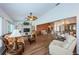 Open living room with wood flooring and access to dining area at 9727 Oakwood Hills Ct, New Port Richey, FL 34655