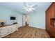 Guest bedroom with wood flooring and built-in storage at 9727 Oakwood Hills Ct, New Port Richey, FL 34655