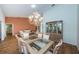 Spacious dining area featuring hardwood floors and built-in hutch at 9727 Oakwood Hills Ct, New Port Richey, FL 34655
