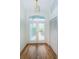 Bright entryway with double doors and wood flooring at 9727 Oakwood Hills Ct, New Port Richey, FL 34655
