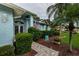 Light blue house exterior with walkway and landscaping at 9727 Oakwood Hills Ct, New Port Richey, FL 34655