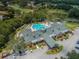 Community clubhouse with pool and parking at 9727 Oakwood Hills Ct, New Port Richey, FL 34655