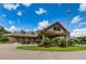 Community clubhouse with golf cart parking at 9727 Oakwood Hills Ct, New Port Richey, FL 34655